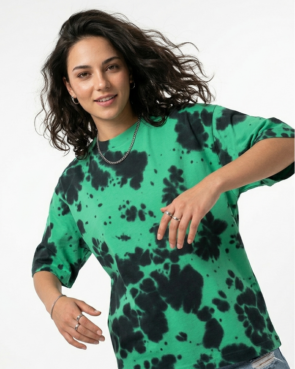Woman wearing a green and black tie-dye t-shirt, casual style, white background