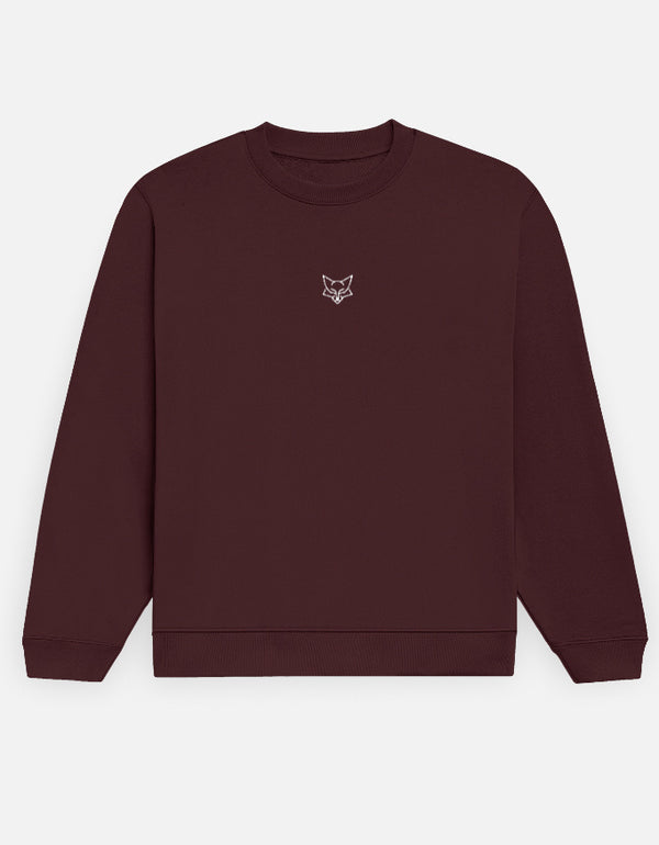 Maroon sweatshirt with a small white logo on a white background