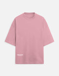 Pink oversized short-sleeve t-shirt with white TinyFox logo on front bottom left
