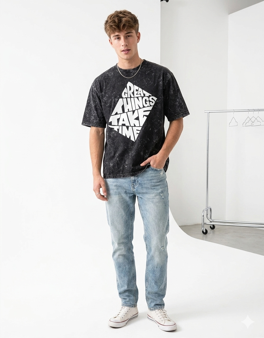 Person wearing a black t-shirt with white text and light blue jeans on a white background - Tinyfox