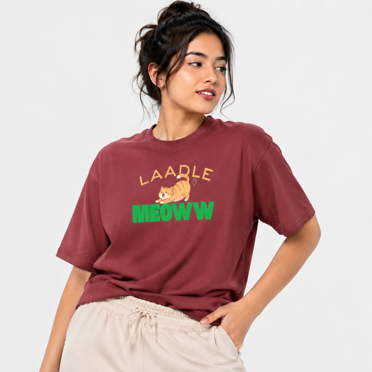 Person wearing a maroon t-shirt with 'LAADLE' and 'MEOW' text and a cat graphic on a white background