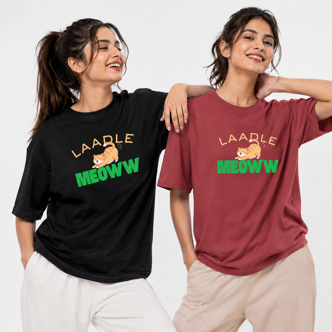 Two women wearing t-shirts with 'LAADLE MEOWW' text and a cat graphic on a white background.