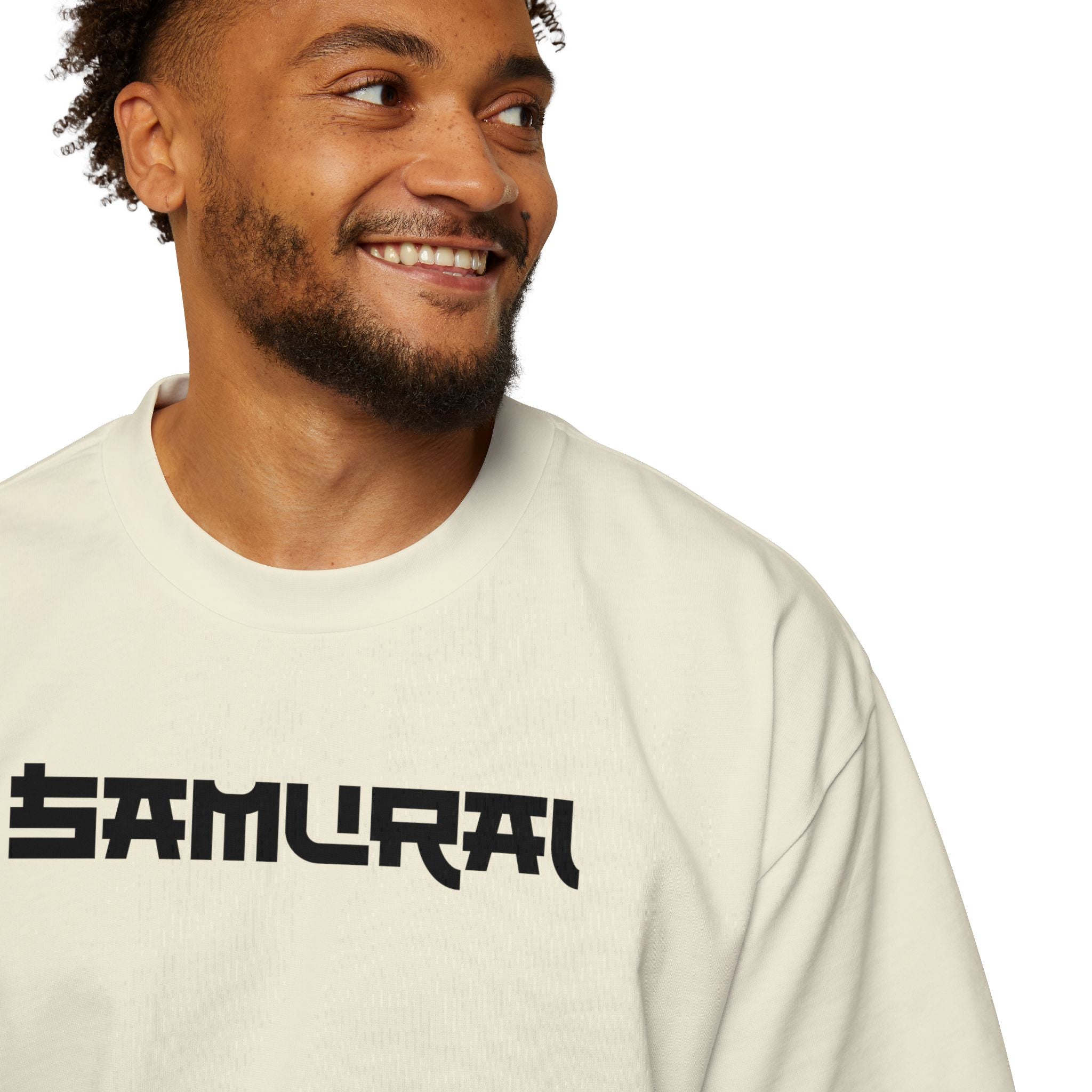 Man wearing a beige long-sleeve shirt with 'SAMURAI' printed on it against a white background