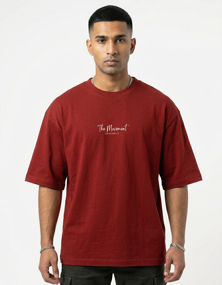 Man wearing a red t-shirt with a logo on a white background